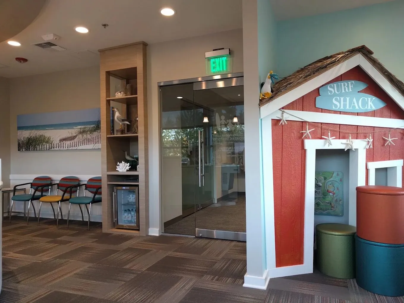 The Surf Shack playhouse next to the waiting area seating
